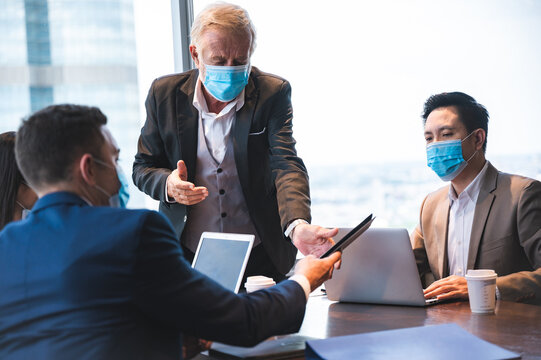 Business Worker Team Meeting Talk With Surgical Face Mask, New Normal Lifestyle Wearing Mask And Have Social Distancing Isolation, Flu Disease Epidemic Protect, Coronavirus COVID-19 Protection Concept