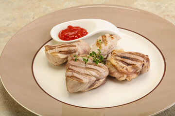 Grilled pork tenderlion with tomato sauce