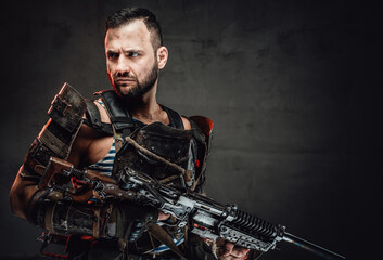 Fototapeta na wymiar Apocalyptic survivor with shotgun in dark background