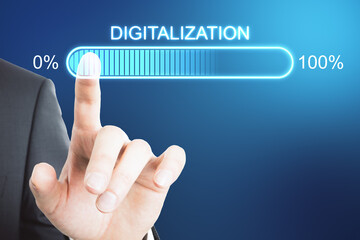 Digital transformation concept with businessman hand on virtual interface with digitalization word and loading bar element.