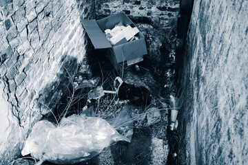 Pile of rubbish. Entrance to the basement of an apartment building. Urban. Ust-Kamenogorsk...