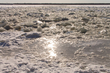 natural texture large fragments of clear ice on the river