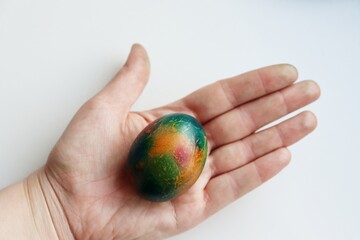 Painted Easter egg at hand