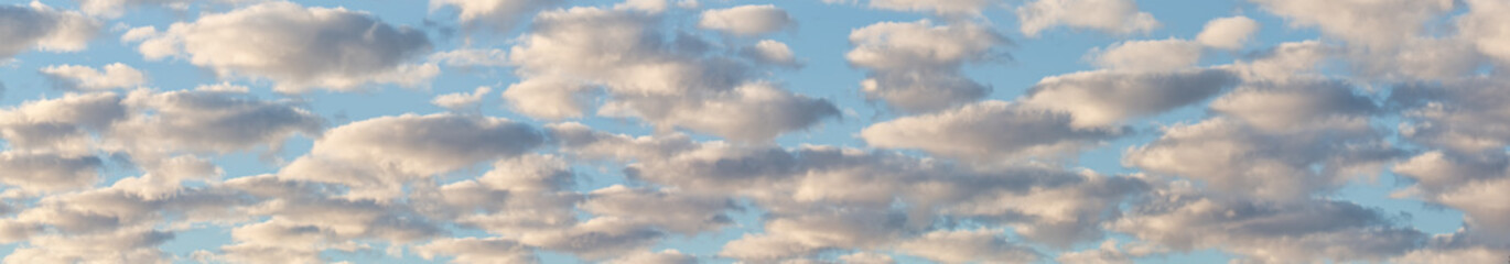 panorama of many clouds in blue sky