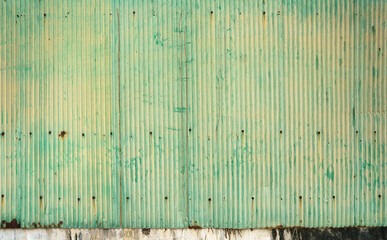 old green zinc and rust. rust on old green zinc background wall. Rusty corrugated metal wall. 