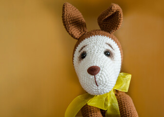 Obraz na płótnie Canvas Cute plush dog. Children's toy. Close-up.