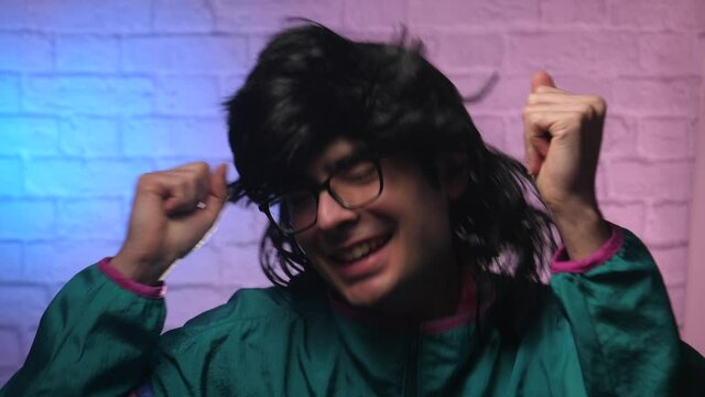 80s 90s vintage looking man danging having fun.