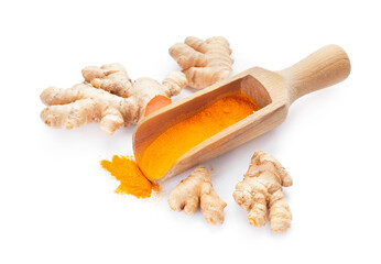 Scoop with turmeric powder and roots on white background