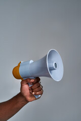 Loudspeaker held by african american person