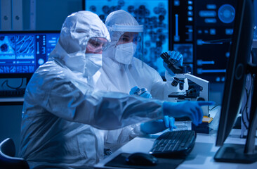 Professional team of scientists is working on a vaccine in a modern scientific research laboratory....