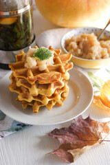 Soft pumpkin waffles with caramelized apples.