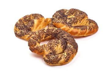 Freshly baked pretzel with poppy seeds, close-up, isolated on white background