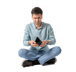 Sad man with empty wallet on white background. Bankruptcy concept