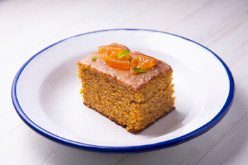 Vegan whole grain orange sponge cake with sugar glaze