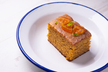 Vegan whole grain orange sponge cake with sugar glaze