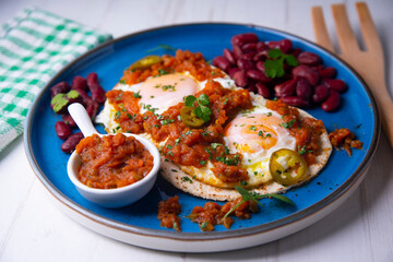 Huevos rancheros with red beans