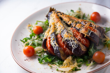 Hasselback Eggplant stuffed with tomato Italian style with cheese