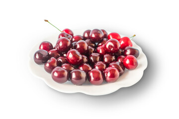 Fresh cherry in a plate, sweet eating, isolated on a white background.