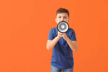 Screaming little boy with megaphone on color background