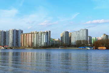 Modern luxury skyscrapers on embankment of the Dnieper River in Kyiv. Concept of modern architecture from glass, steel and concrete. New high-rise fashionable houses on embankment of Dnipro River