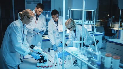 Team of Medical Research Scientists Have Meeting and Conduct Experiments with Help of DNA Samples...