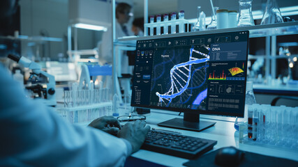 Medical Research Scientist Working on Desktop Computer with Gene Analysis Software in Modern...