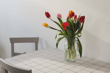 Bouquet of tulips in a vase on the table