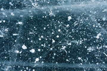 bubbles in blue transparent ice on the lake