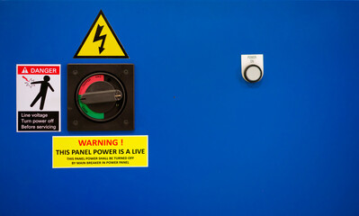 View of operating handle switch on electrical cabinet of automation machine.