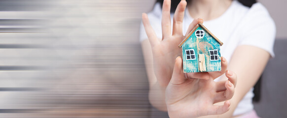 girl holding a model at home