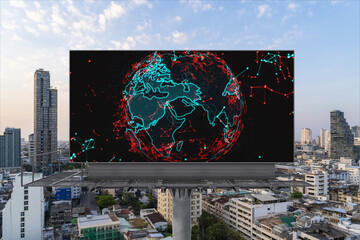 Glowing hologram of Earth planet map on billboard over aerial panoramic cityscape of Bangkok at sunset. The concept of international business in Southeast Asia.