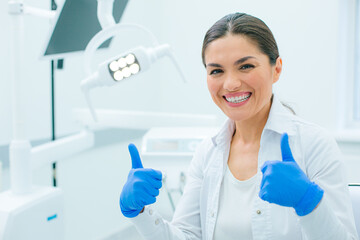 Fototapeta premium Contented medical worker demonstrating her joyful mood