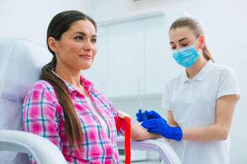 Young woman feeling confident while donating blood