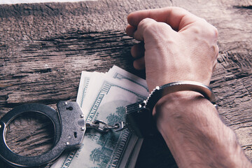 money and handcuffs bribery of the authorities