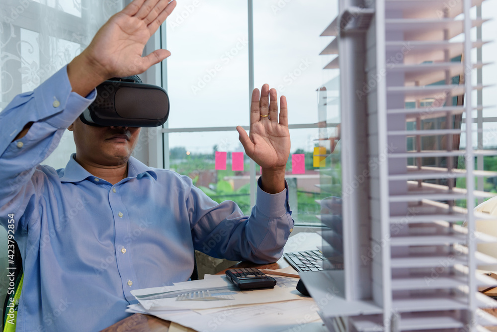 Fototapete engineer or architects wearing virtual reality headsets for work with virtual reality modeling softw