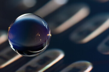 Glass ball close up view in the computer screen image background