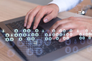 Hands of hr specialist is typing the keyboard in the internet to find the best candidates to create international network in recruitment process. Formal wear. Social media hologram icons.