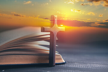 wooden cross on the book