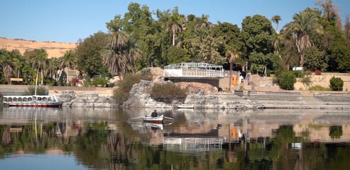 Lake Nasser with rocks, blue water 
in Aswan Governorate, Upper Egypt, near the border with Sudan.