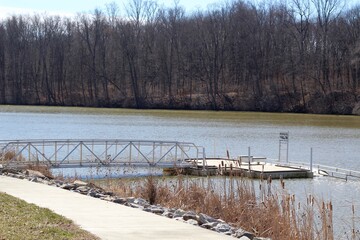 The metal dock at the lake on a sunny day.