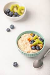 Oatmeal porridge with berries and fruits. Healthy breakfast