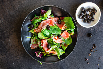 salad jamon prosciutto green leaves mix lettuce olives vegetables meat snack healthy meal top view copy space food background rustic image