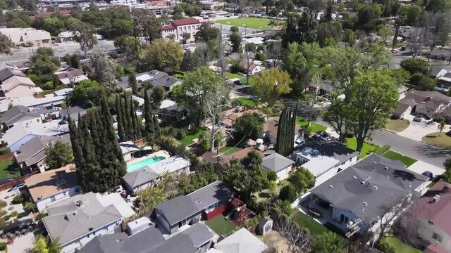 Aerial forward over residential neighborhood of Van Nuys city, Los Angeles