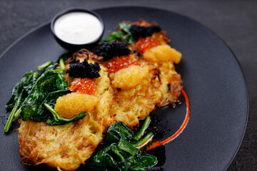 Hash brown potato, vegetable pancakes with caviar