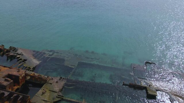 4K clip flying over a shipwreck in the  tropical beach of Epanomi, Norhtern Greece