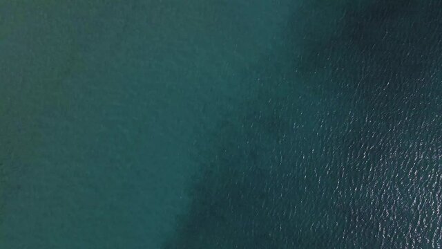 4K overhead moving forward clip over a shipwreck in the  tropical beach of Epanomi, Norhtern Greece