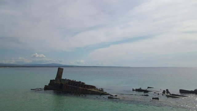 4K clip flying over a shipwreck in the  tropical beach of Epanomi, Norhtern Greece