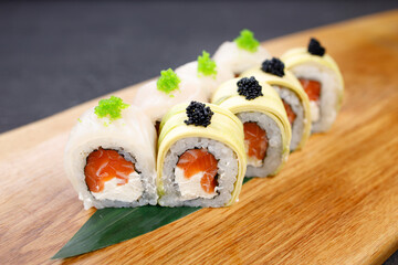 Seafood delicatessen sushi rolls set on board