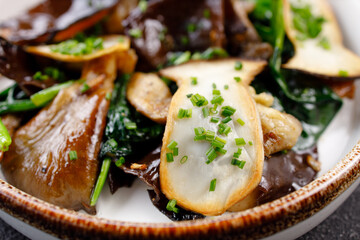 Vegan saute with mushrooms, aubergines and spinach