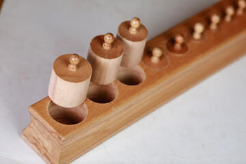 montessori sensorics cylinder block low to high and color blue box with cylinders